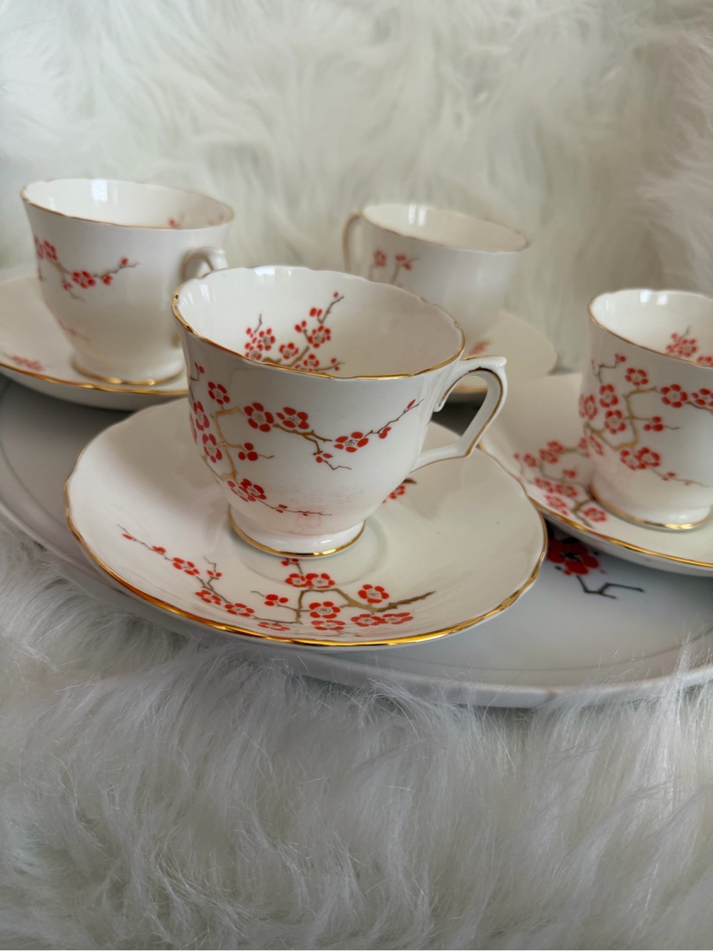 Porcelain Cherry Blossom Teacup and Saucer Set in White with Red Floral Accents